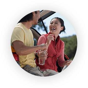 Man And Woman Laughing And Leaning Against Their Suv - Quest Diagnostics Publicidad (361x361), Png Download