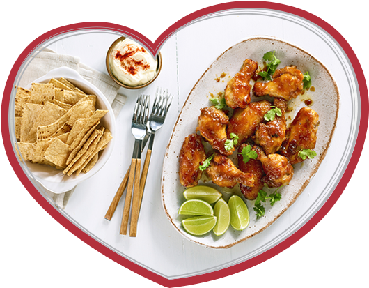 An Image Of Maple Glazed Chicken Wings In A Bowl With - Sesame Chicken (530x413), Png Download