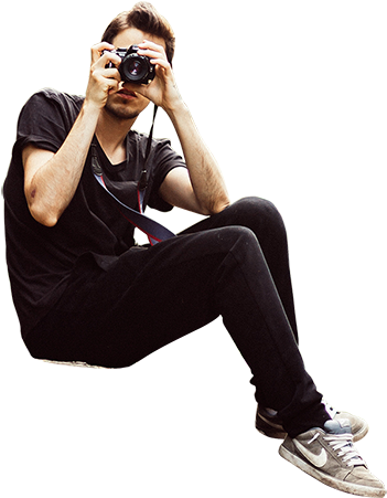 A Hipster Looking Man Is Seated On A Hill And Taking - Person Sitting On The Edge Png (450x450), Png Download