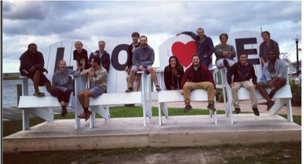 Group Of People Sitting On Over Sized Chairs With Love (1009x335), Png Download