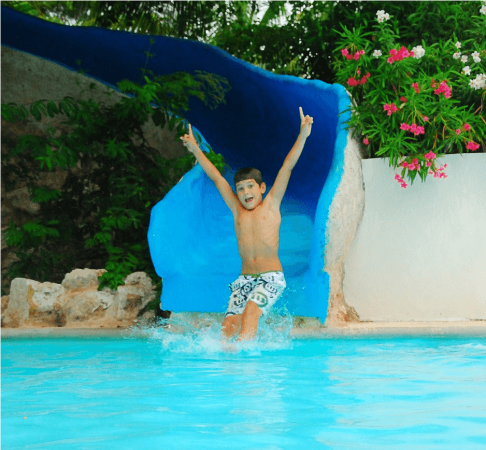 Child With Juice On Small Bed In Pool Area At Kiddozone (1400x900), Png Download